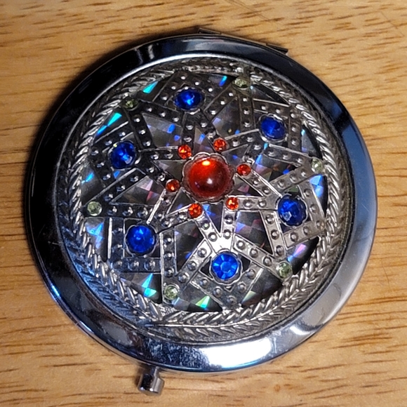 Compact, Stainless Steel, with Luminescent Background behind Design. 2" Diameter - Picture 1 of 7